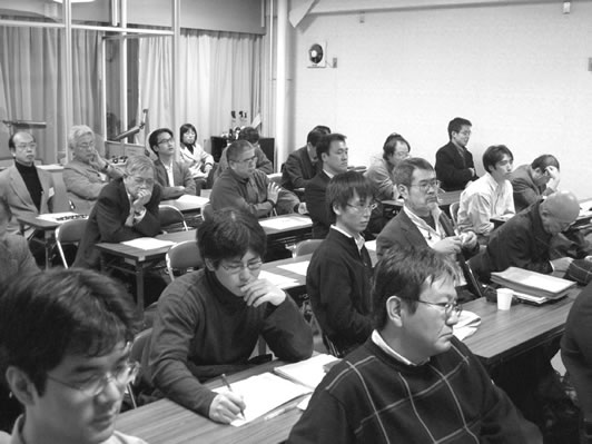 An attentive audience in the rear of the hall